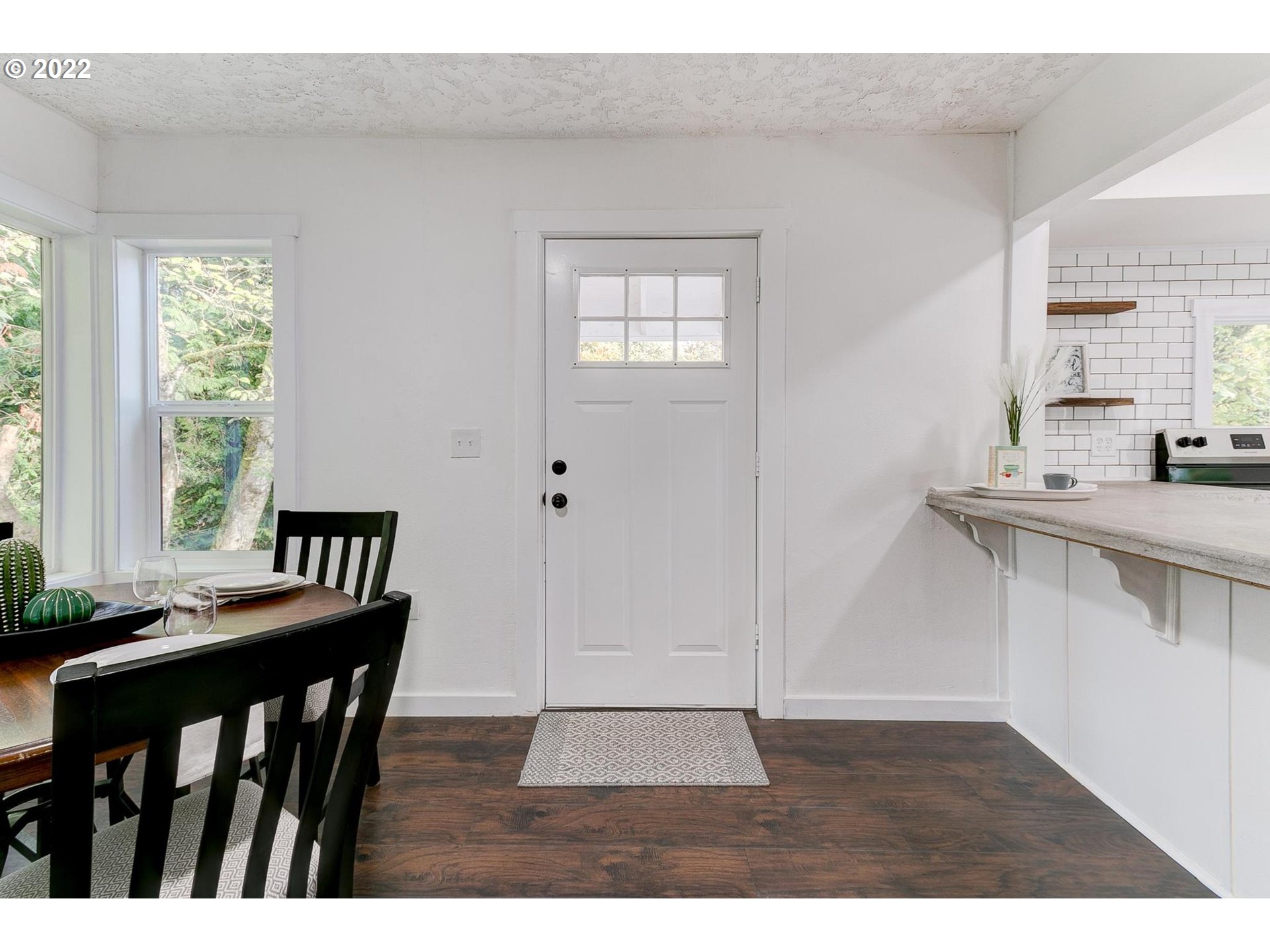 33719 Bennett Road Warren, OR 97053 - Photo 3 of 32 a view of a dining room with furniture window and wooden floor