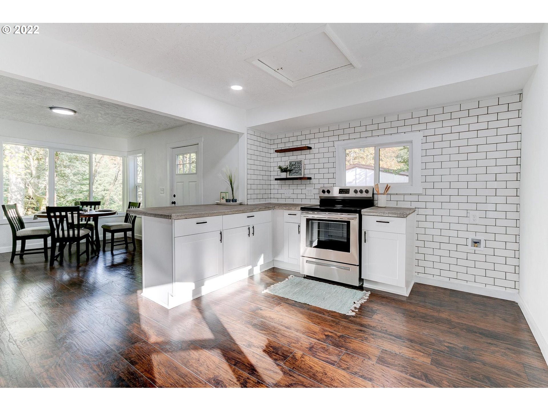 33719 Bennett Road Warren, OR 97053 - Photo 6 of 32 a kitchen with a cabinets and chairs