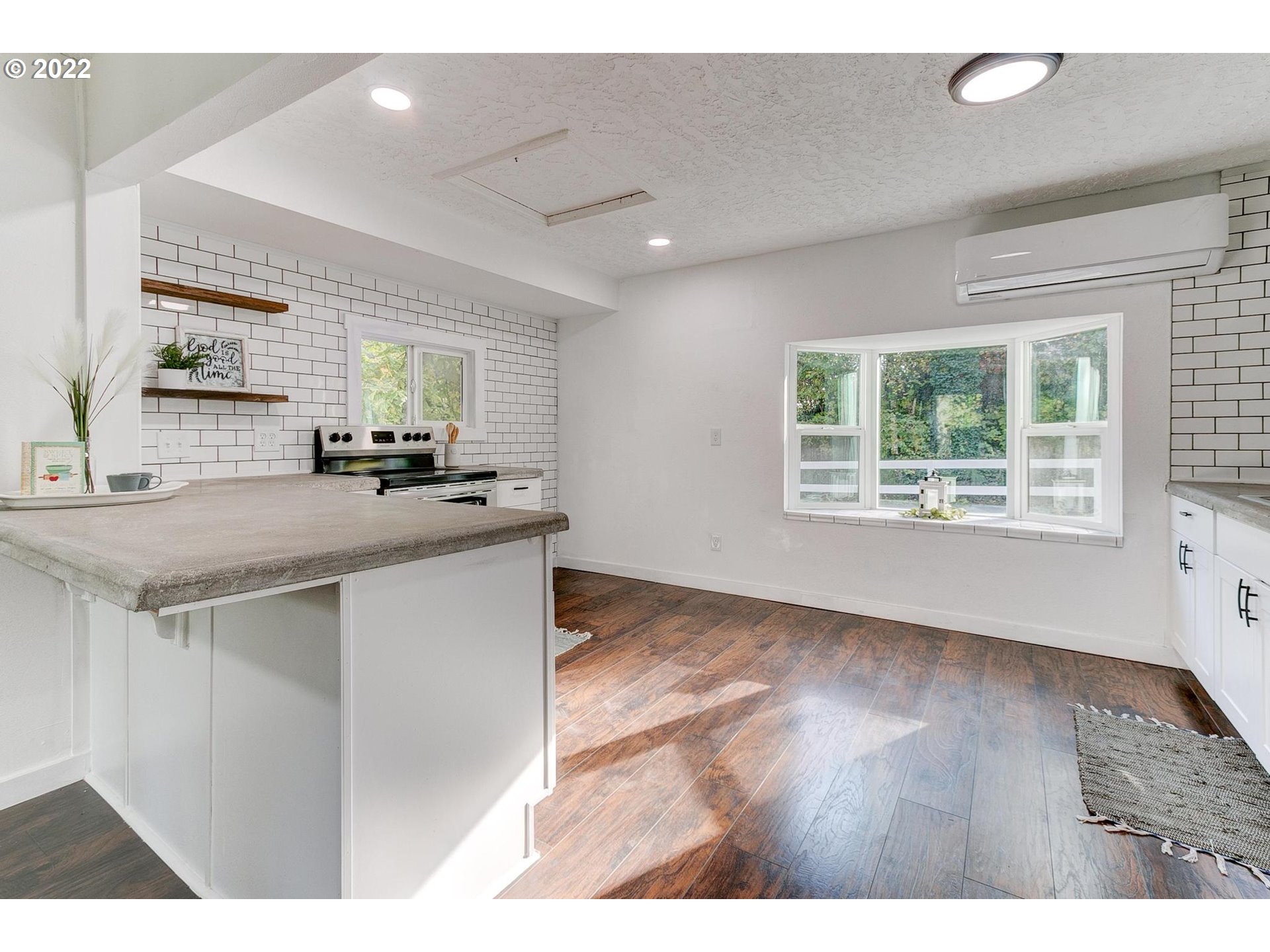 33719 Bennett Road Warren, OR 97053 - Photo 7 of 32 a kitchen with stainless steel appliances granite countertop a sink cabinets and a large window