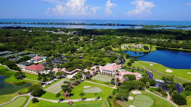 an aerial view of a houses with a lake view