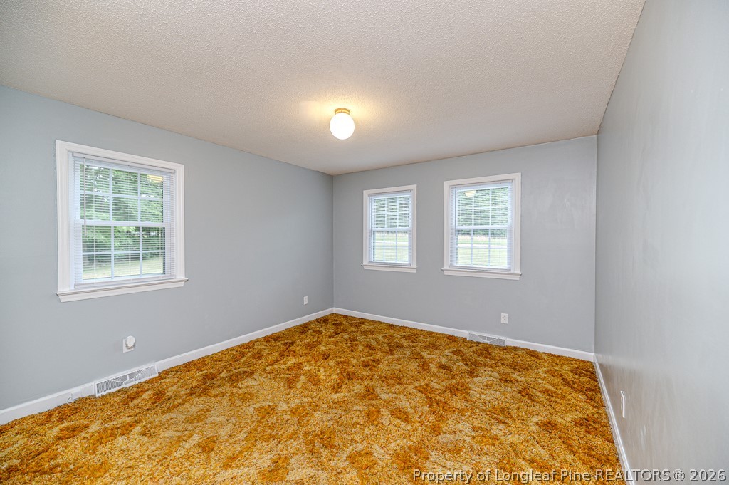 3384 Goldston Glendon Road Goldston, NC 27252 - Photo 24 of 47 a view of an empty room with a window