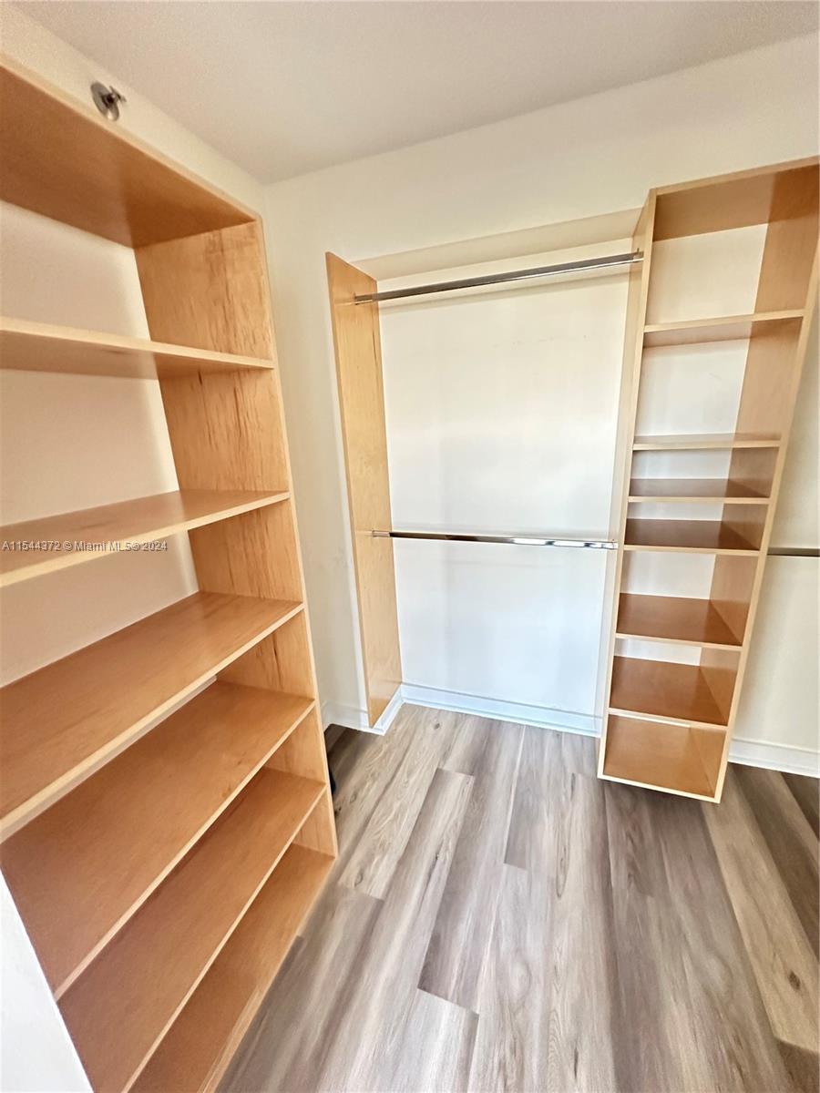 Nirvana Condominiums Miami, FL 33138 - Photo 6 of 13 a view of walk in closet with empty racks