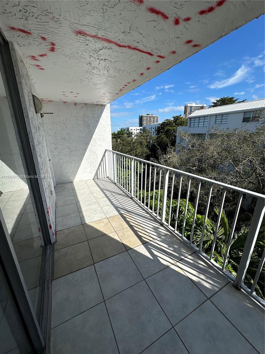 Nirvana Condominiums Miami, FL 33138 - Photo 10 of 13 a view of balcony with wooden floor