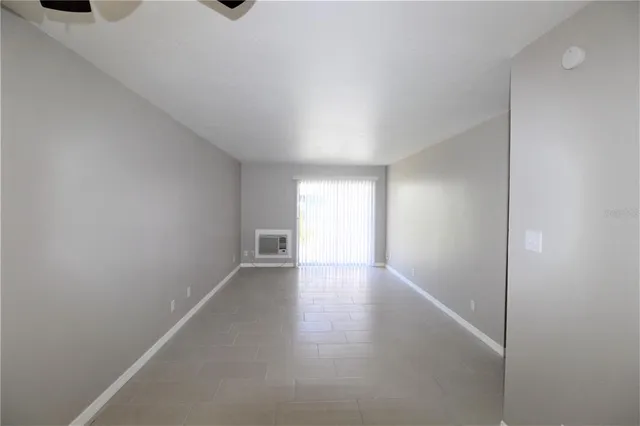 a view of an empty room and window