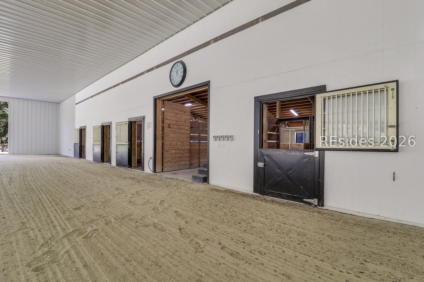 165 Golda Drive Ridgeland, SC 29936 - Photo 80 of 100 Entry to Arena from Horse Stalls Area