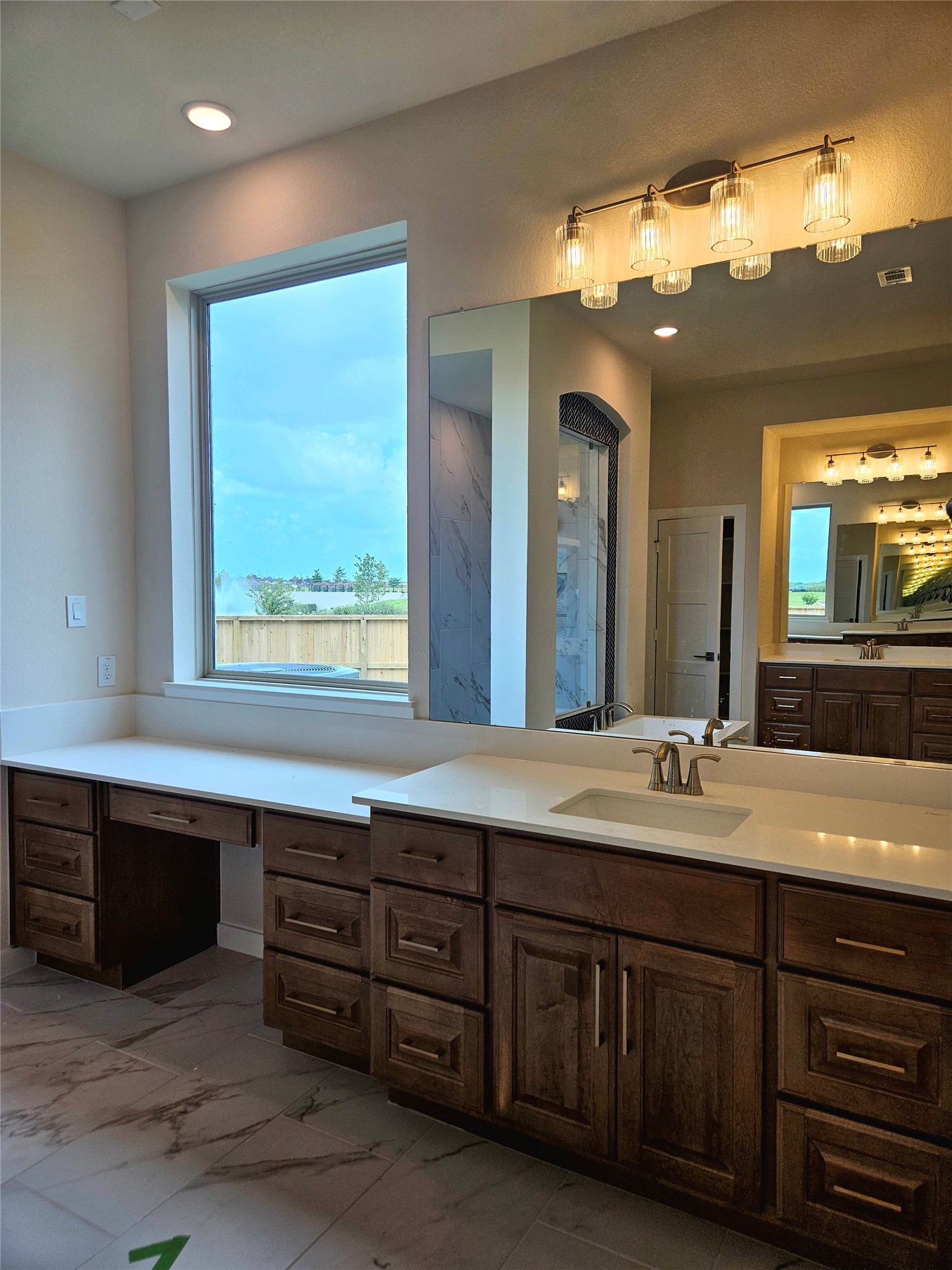 8701 Antelope Cyn Way Manvel, TX 77578 - Photo 21 of 32 a bathroom with a double vanity sink and a mirror
