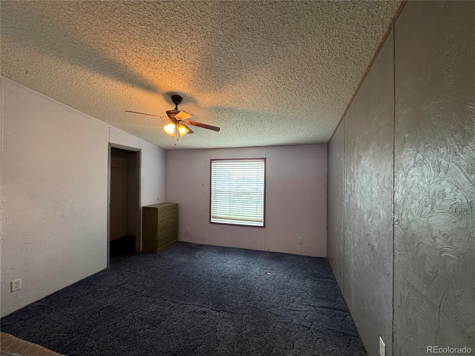 28983 County Road Aguilar, CO 81020 - Photo 20 of 24 a view of a livingroom with a ceiling fan and window