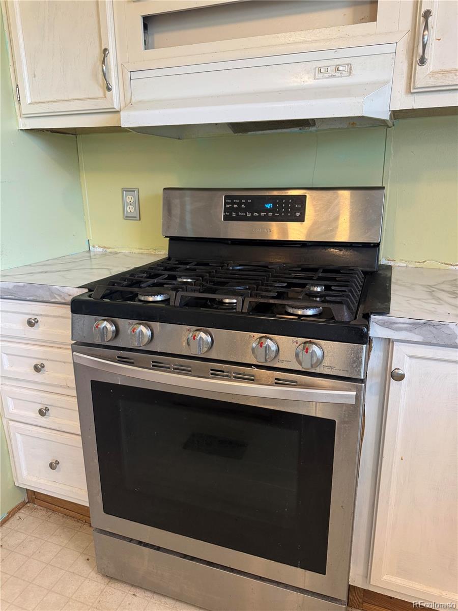 28983 County Road Aguilar, CO 81020 - Photo 23 of 24 a stove top oven sitting inside of a kitchen
