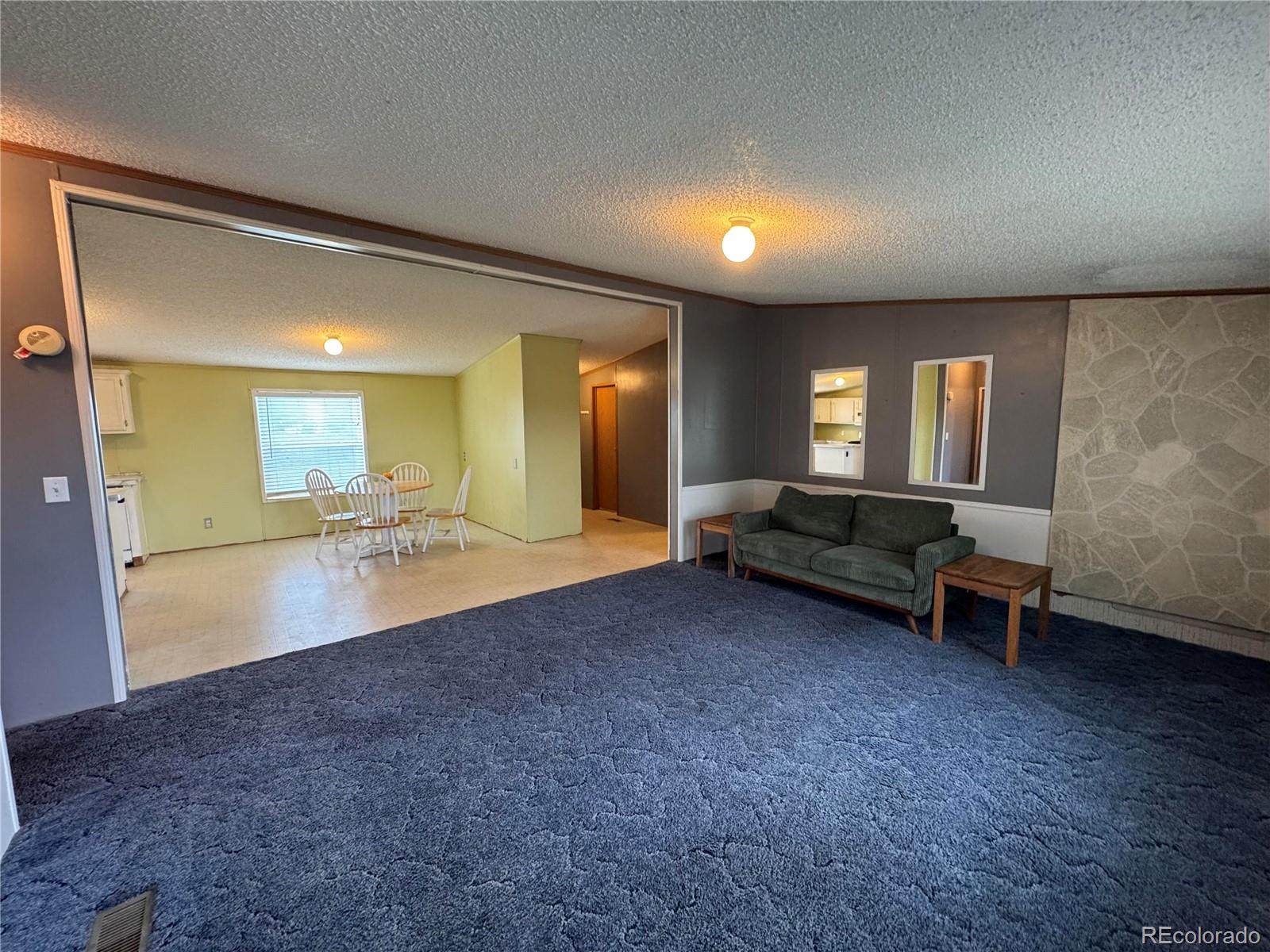 28983 County Road Aguilar, CO 81020 - Photo 7 of 24 a lobby with furniture and a wooden floor