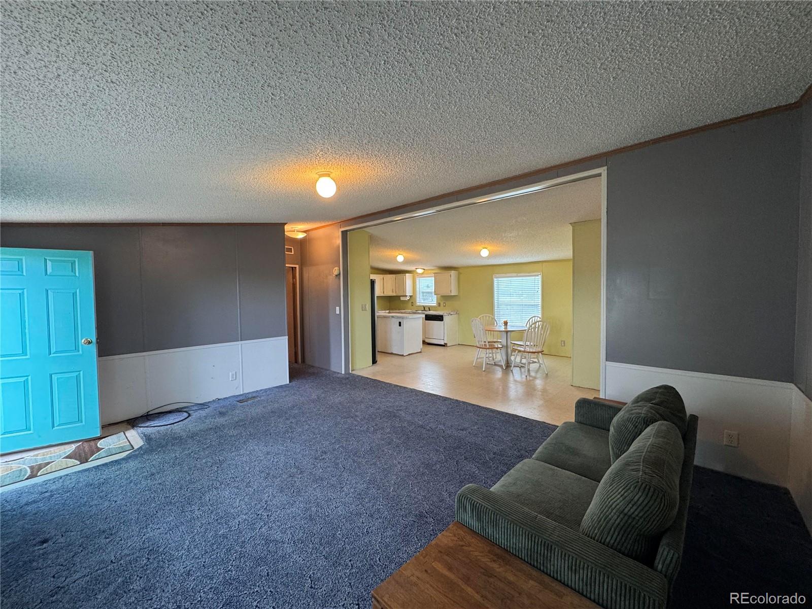 28983 County Road Aguilar, CO 81020 - Photo 9 of 24 a living room with furniture and a wooden floor