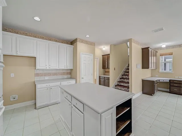 a kitchen with a cabinets and appliances