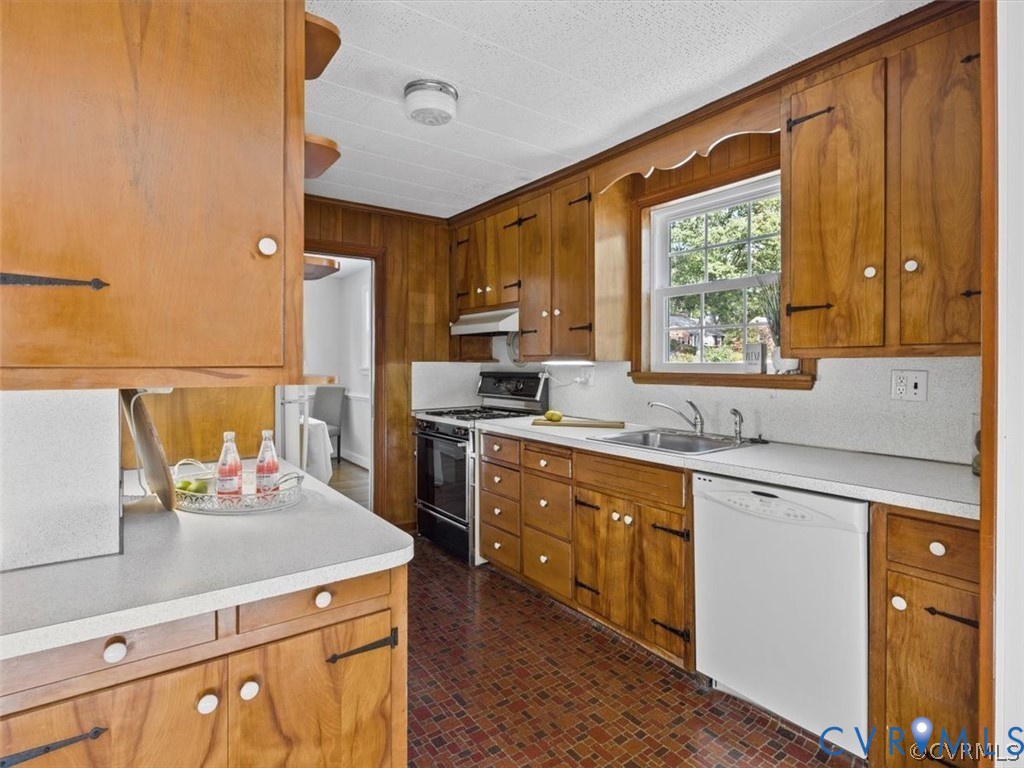 8719 Mapleton Road Henrico, VA 23229 - Photo 10 of 20 Wood-paneled kitchen featuring extensive wood cabi