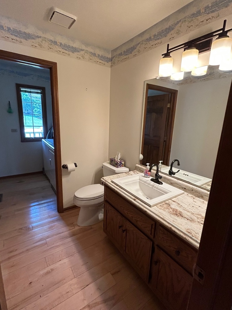 122 San Carlos Road Minooka, IL 60447 - Photo 24 of 35 a bathroom with a double vanity sink and mirror with shower