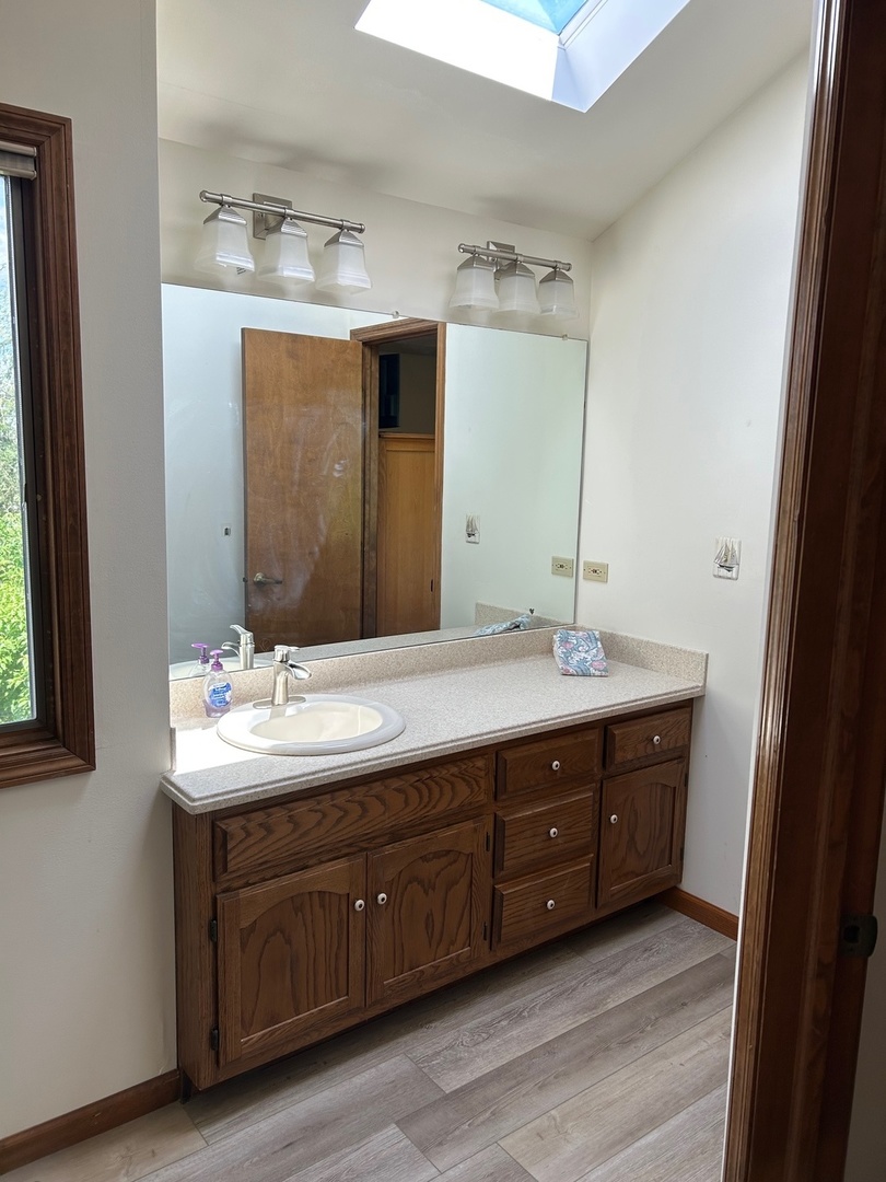 122 San Carlos Road Minooka, IL 60447 - Photo 10 of 35 a bathroom with a double vanity sink and mirror