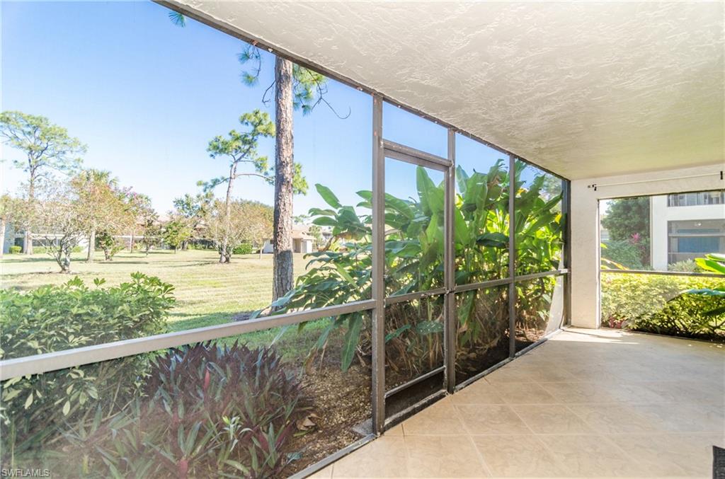 1220 Commonwealth Circle, Unit M106 Naples, FL 34116 - Photo 6 of 16 a view of a garden