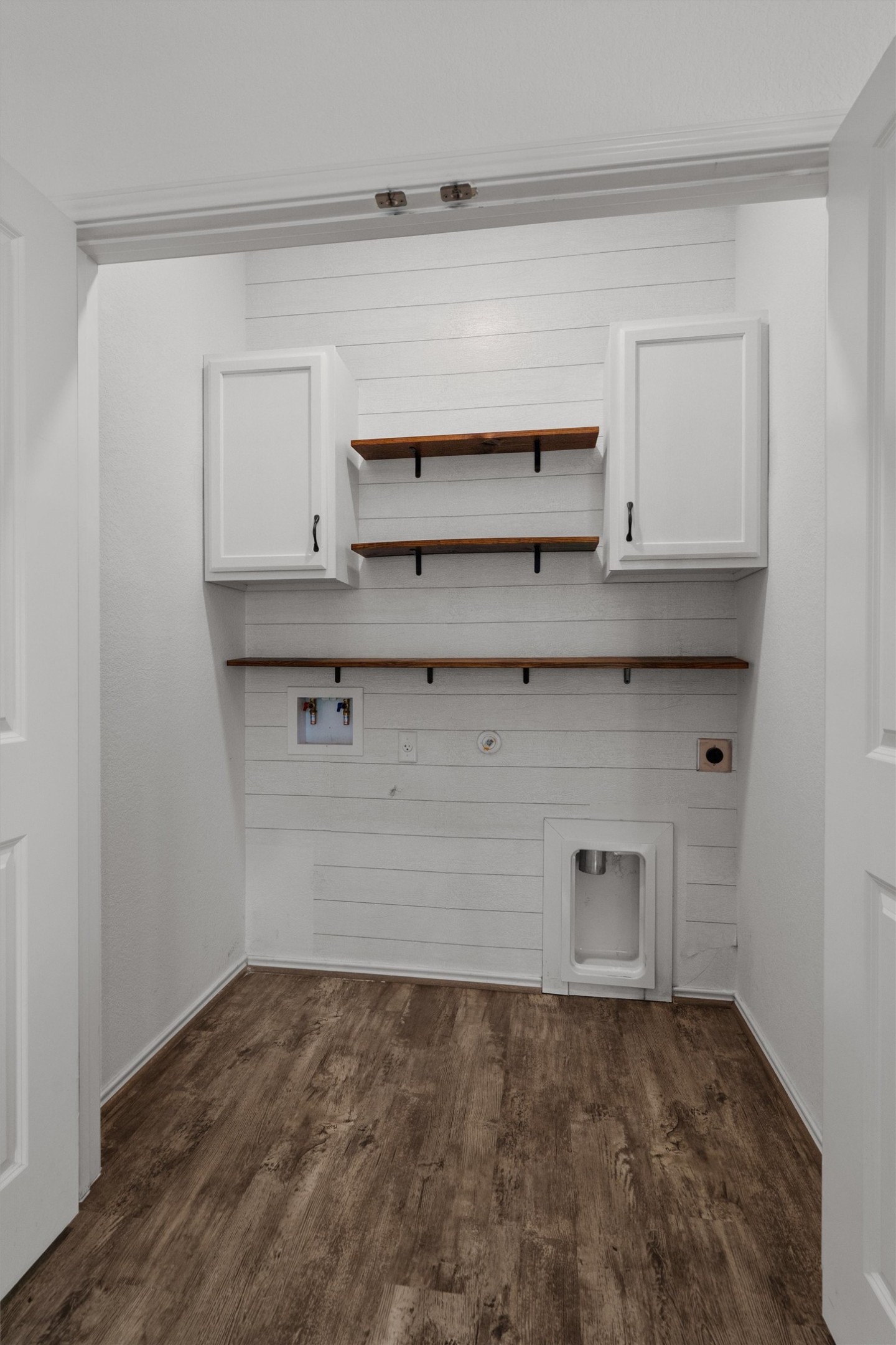 791 Circle Way Jarrell, TX 76537 - Photo 28 of 36 Dedicated laundry area featuring wood-finish flooring and white shiplap-style wall paneling