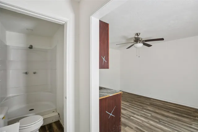 a bathroom with a sink and shower