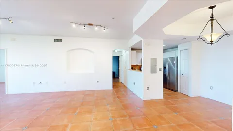 a view of a big room with closet and windows
