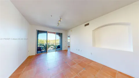 a kitchen with stainless steel appliances granite countertop a refrigerator and a stove