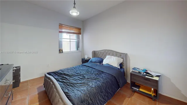 a bathroom with a sink a toilet a mirror and shower curtain