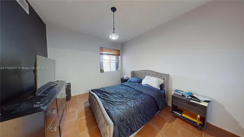 a bathroom with a double vanity sink toilet and shower