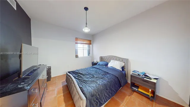 a bathroom with a sink and mirror with toilet