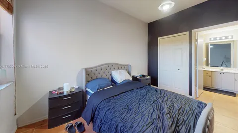 a bathroom with a sink and mirror with toilet