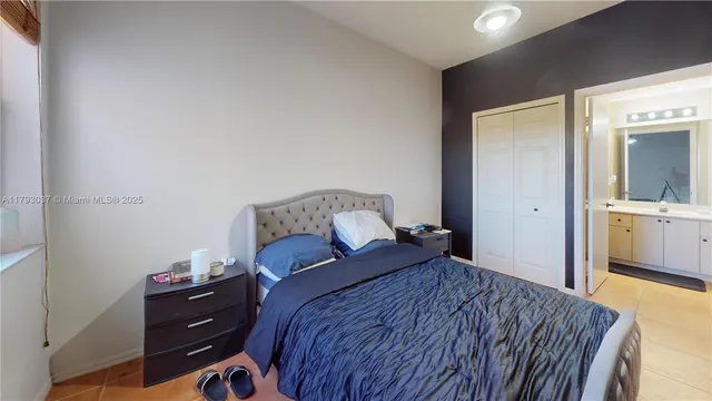 a bathroom with a sink and mirror with toilet