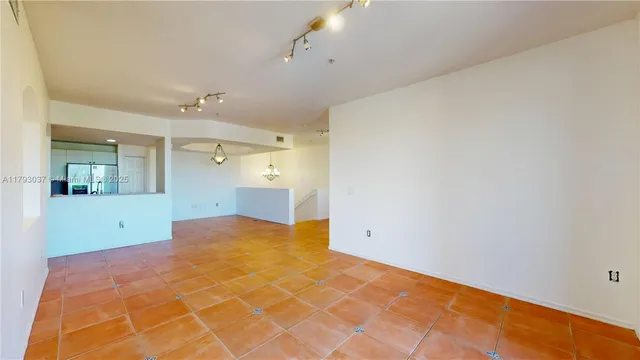 a view of a room with closet and windows