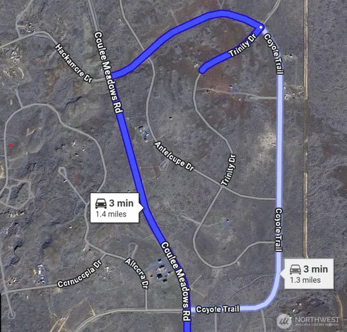 an aerial view of house with yard and mountain in the background