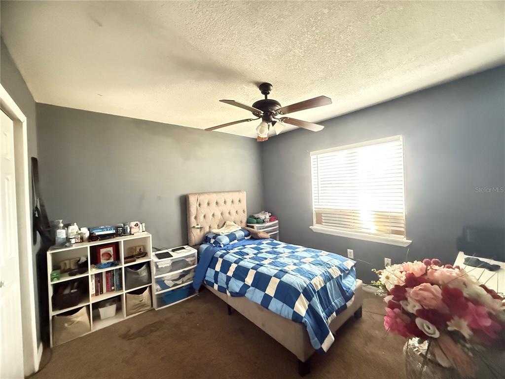 1944 South Conway Road, Unit 3 Orlando, FL 32812 - Photo 12 of 20 a bedroom with a bed and window