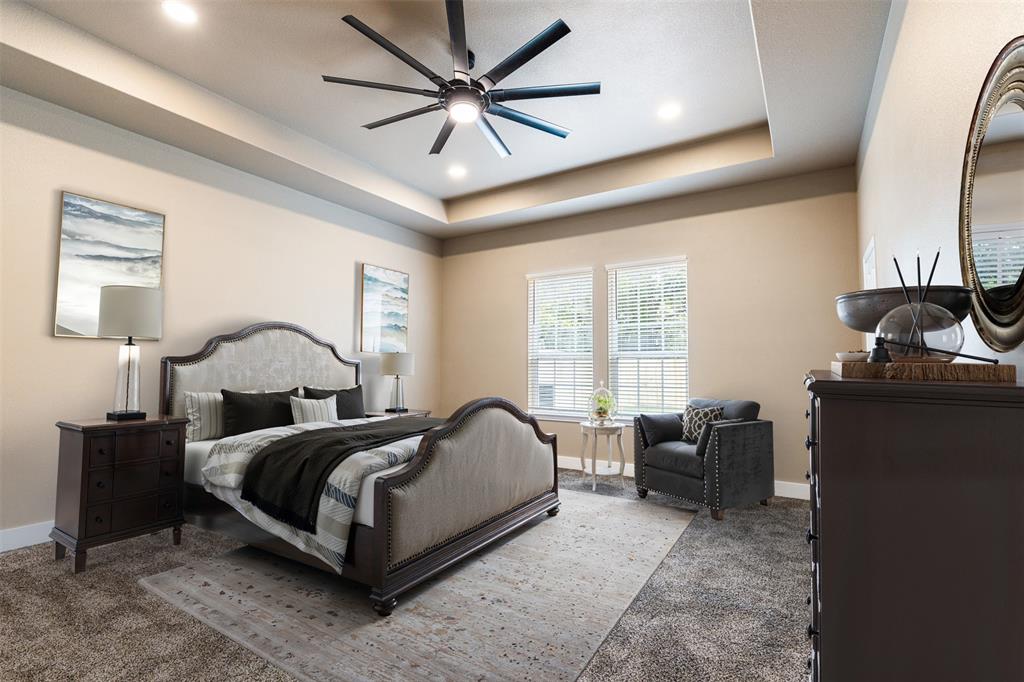 413 Henderson Street Bonham, TX 75418 - Photo 15 of 27 a bedroom with a bed and window