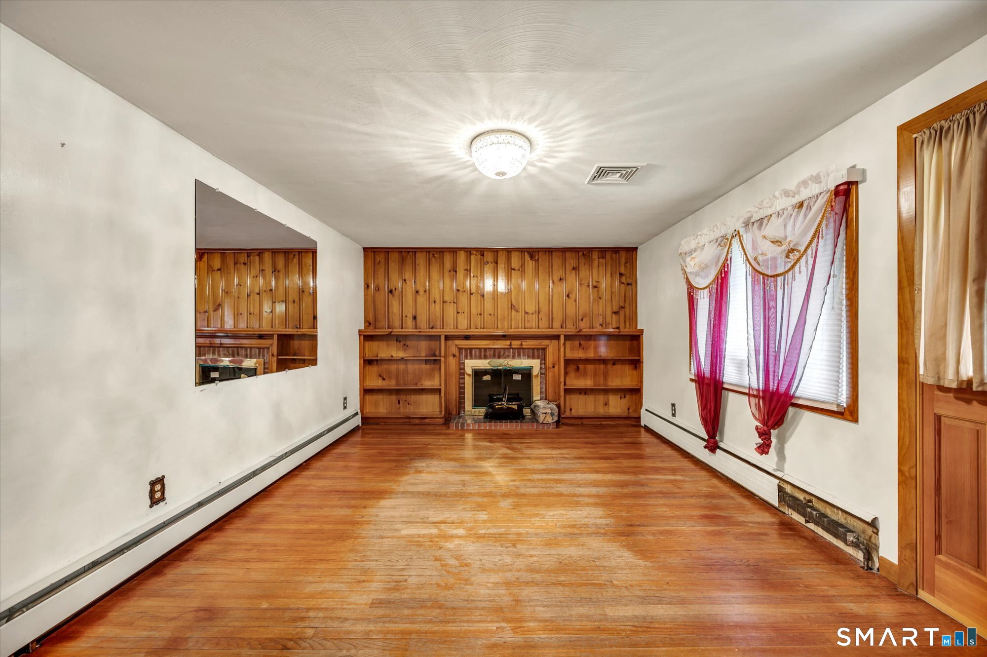 740 Rainbow Road Windsor, CT 06095 - Photo 19 of 40 a big room with wooden floor and windows