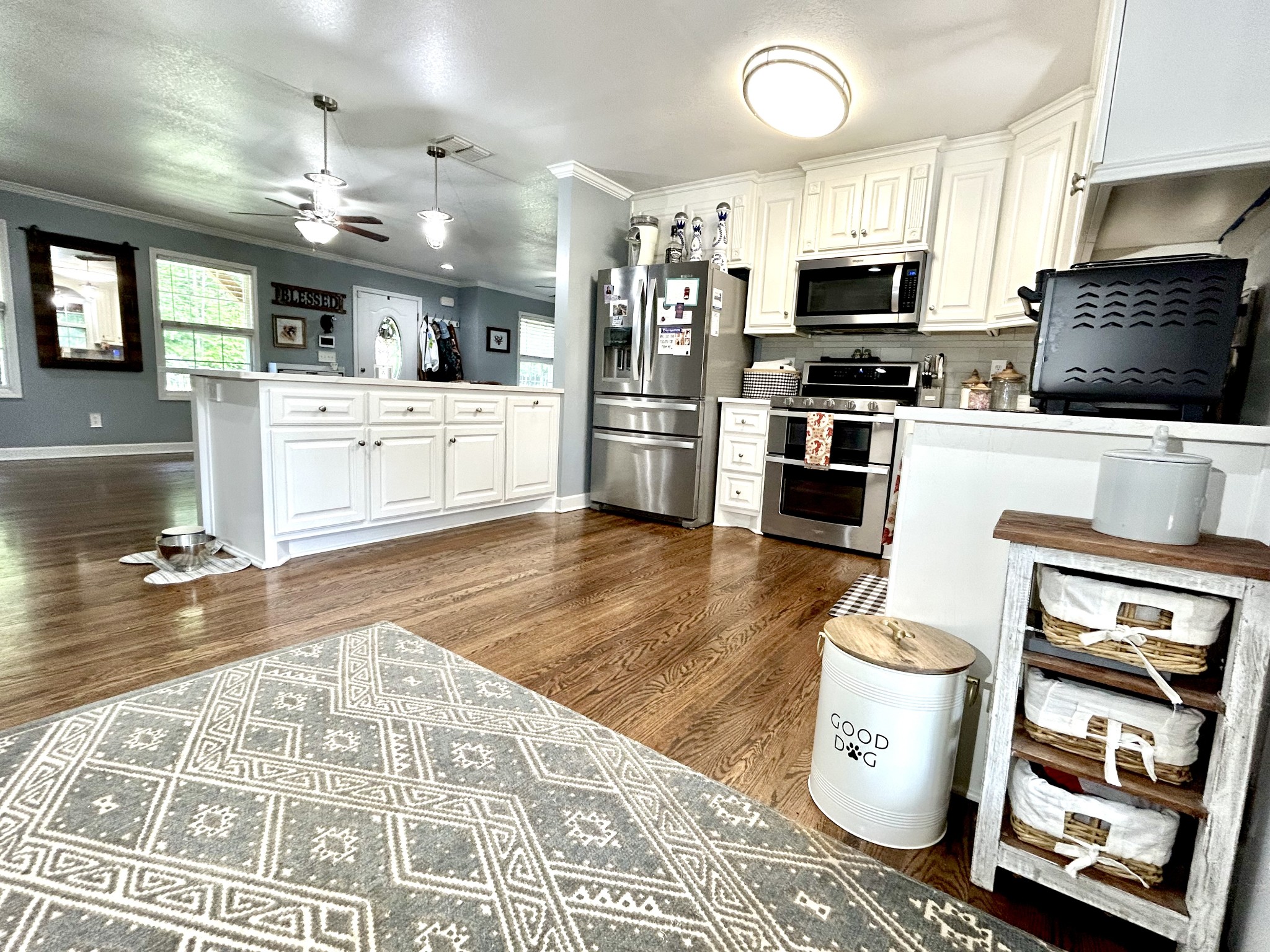 1198 Ed Sanders Road Lynchburg, TN 37352 - Photo 10 of 36 a kitchen with stainless steel appliances kitchen island granite countertop a stove a sink and a microwave