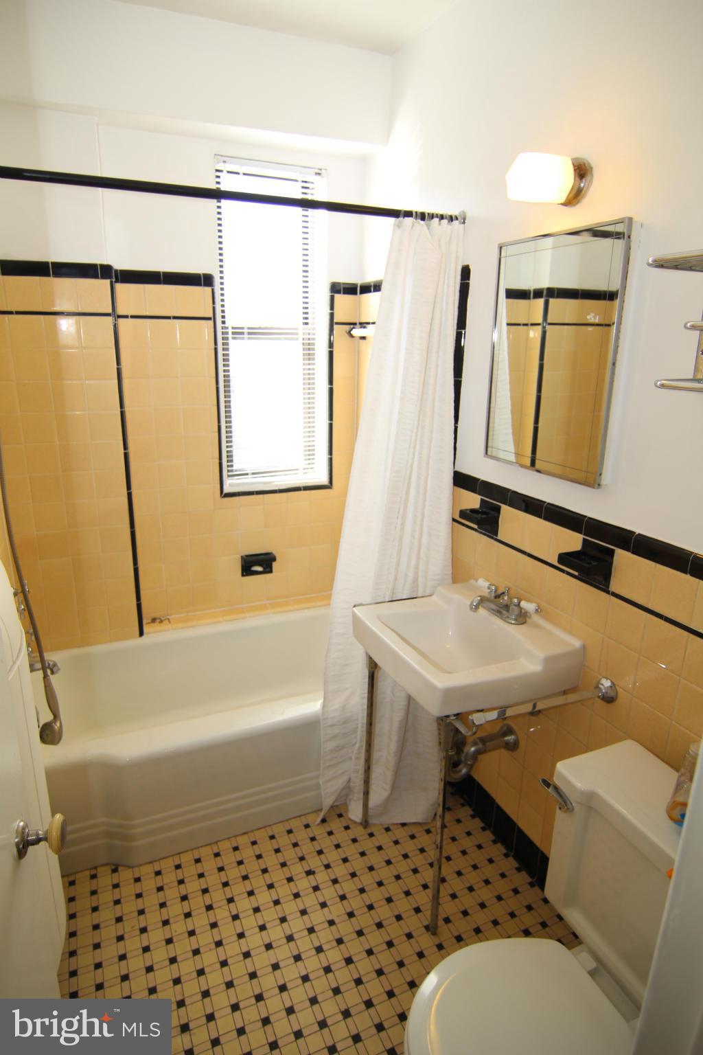 1 Scott Circle Northwest, Unit 510 Washington, DC 20005 - Photo 9 of 14 a bathroom with a sink toilet and shower