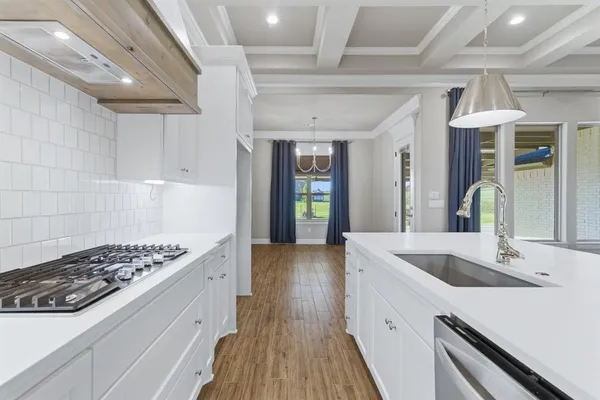 a kitchen with sink and stove
