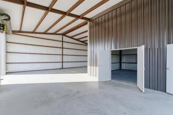 a view of an empty room with a staircase