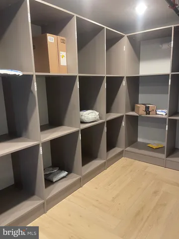 a bathroom with a black and white checkered floor