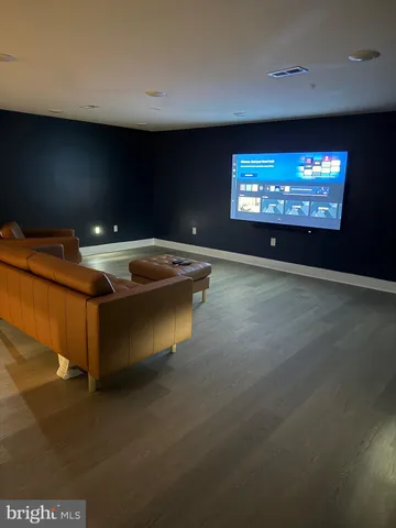 a room with furniture and a flat screen tv
