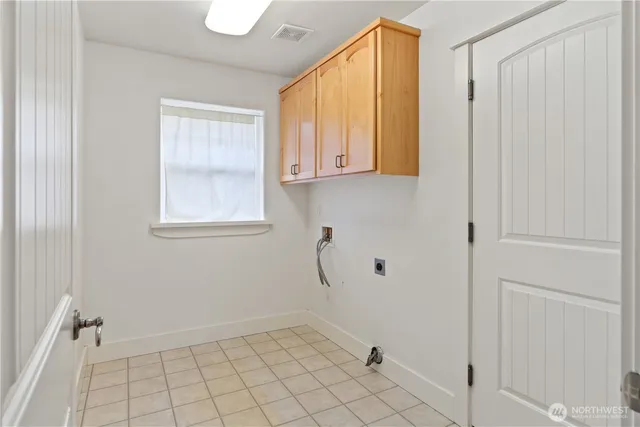 a view of a livingroom with furniture and floor to ceiling window