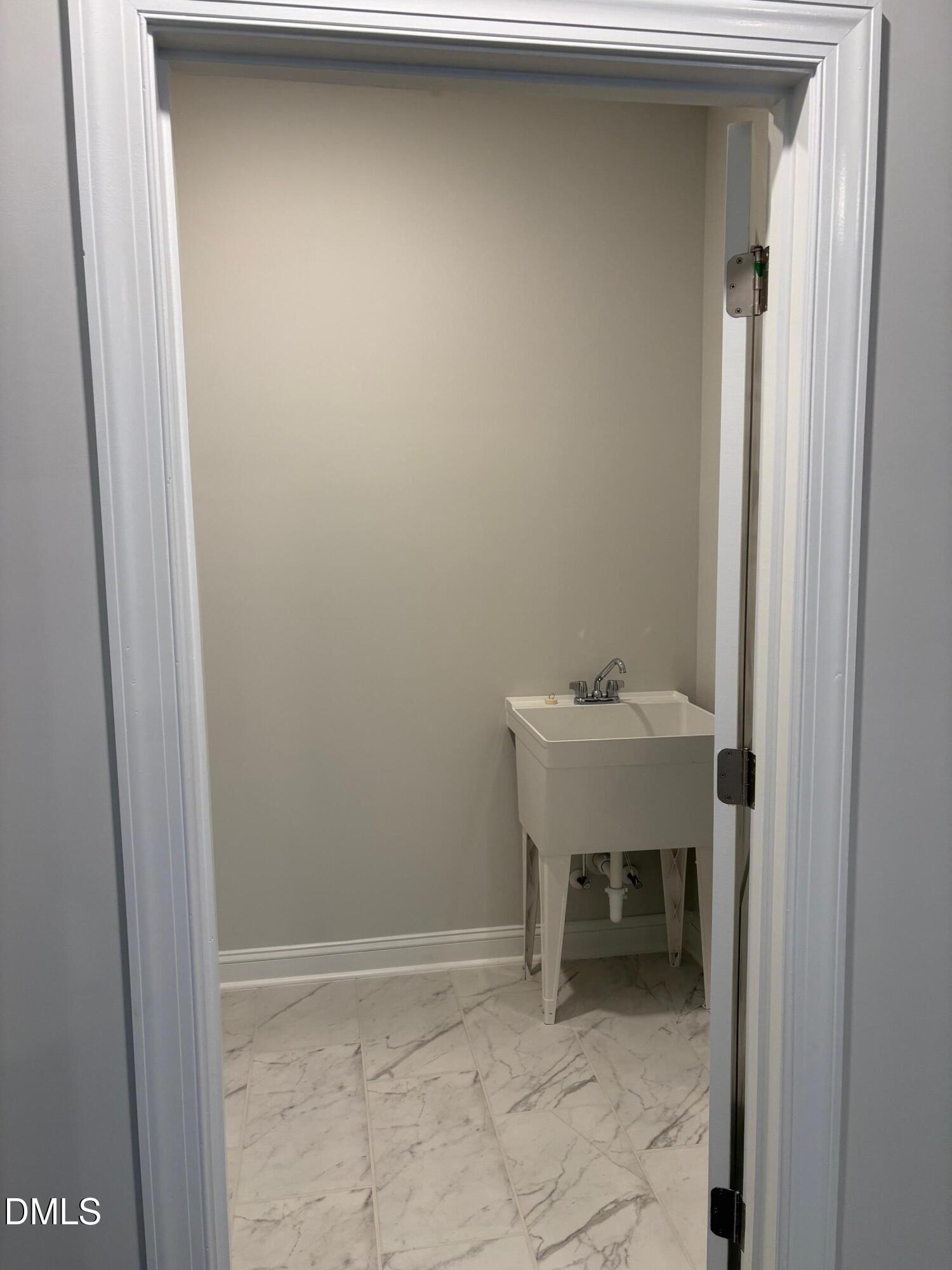 104 Corapeake Way Apex, NC 27539 - Photo 11 of 27 a bathroom with a sink and a mirror