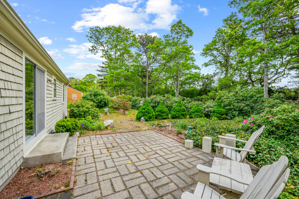 59 Beverly Road West Yarmouth, MA 02673 - Photo 9 of 33 a view of a backyard with sitting area