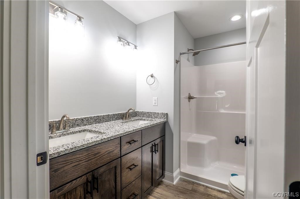 0 Howerton Road Dunnsville, VA 22454 - Photo 11 of 11 a bathroom with a granite countertop shower sink and vanity