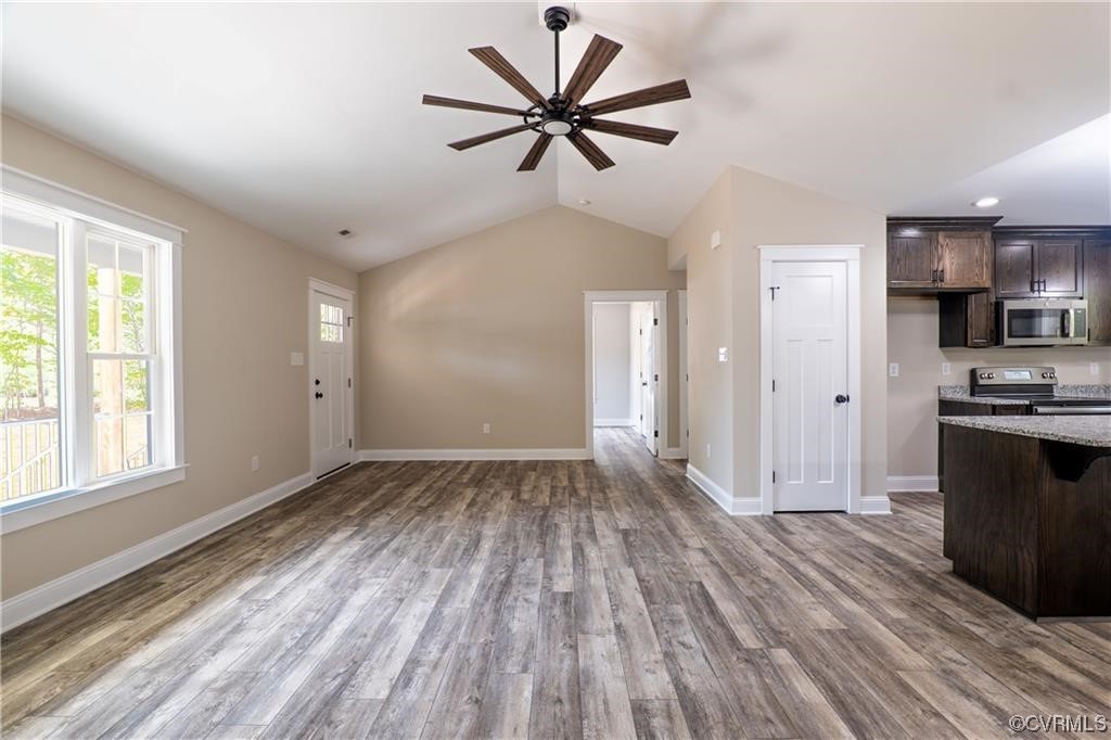 0 Howerton Road Dunnsville, VA 22454 - Photo 2 of 11 a view of an empty room with a window and wooden floor