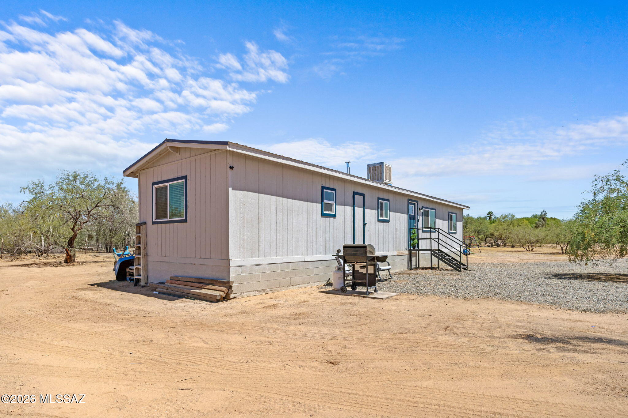 13140 West El Lobo Road Tucson, AZ 85743 - Photo 25 of 30 It is located just 20 minutes from the I-10 and offers unlimited outdoor space with established trees.