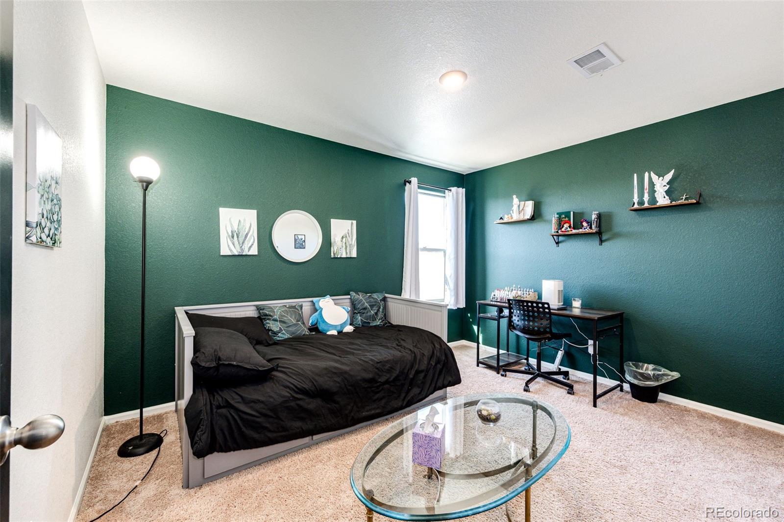 325 Walnut Street Bennett, CO 80102 - Photo 13 of 22 a living room with furniture and a wooden floor