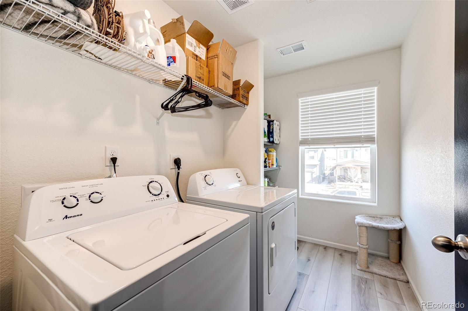 325 Walnut Street Bennett, CO 80102 - Photo 14 of 22 a utility room with dryer and washer
