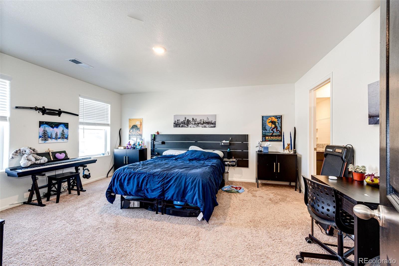 325 Walnut Street Bennett, CO 80102 - Photo 15 of 22 a living room with furniture and a dining table