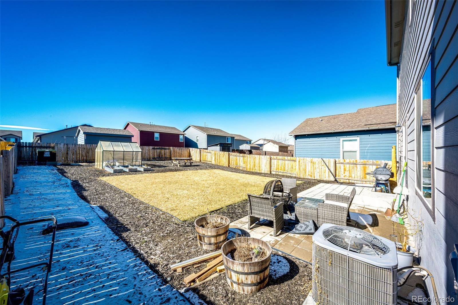 325 Walnut Street Bennett, CO 80102 - Photo 19 of 22 a room with furniture and a table