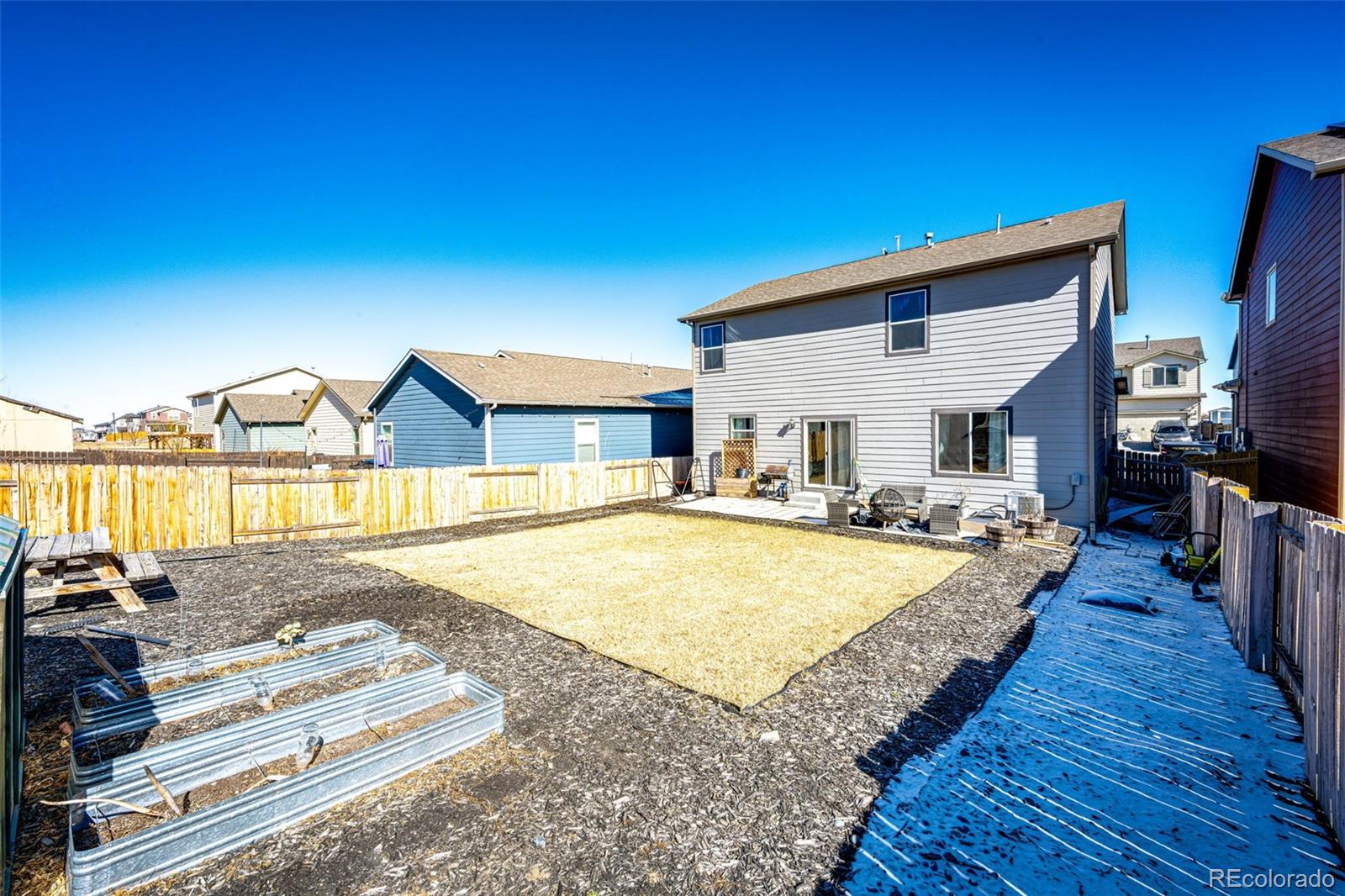 325 Walnut Street Bennett, CO 80102 - Photo 21 of 22 a view of a house with swimming pool